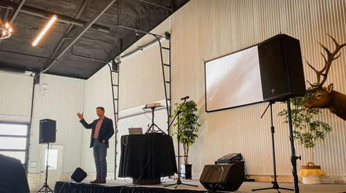 event speaker on stage wide shot